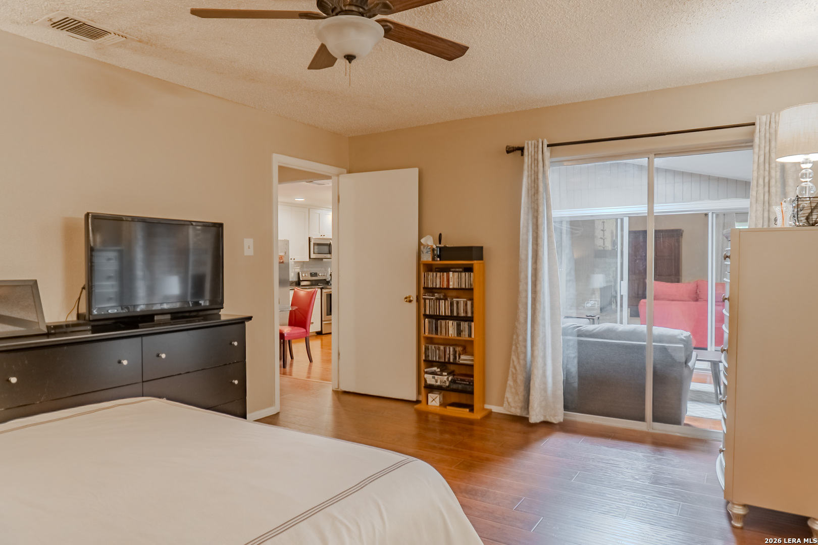 8942 Willmon Way Windcrest, TX 78239 - Photo 29 of 44 a kitchen with stainless steel appliances a refrigerator and a stove top oven