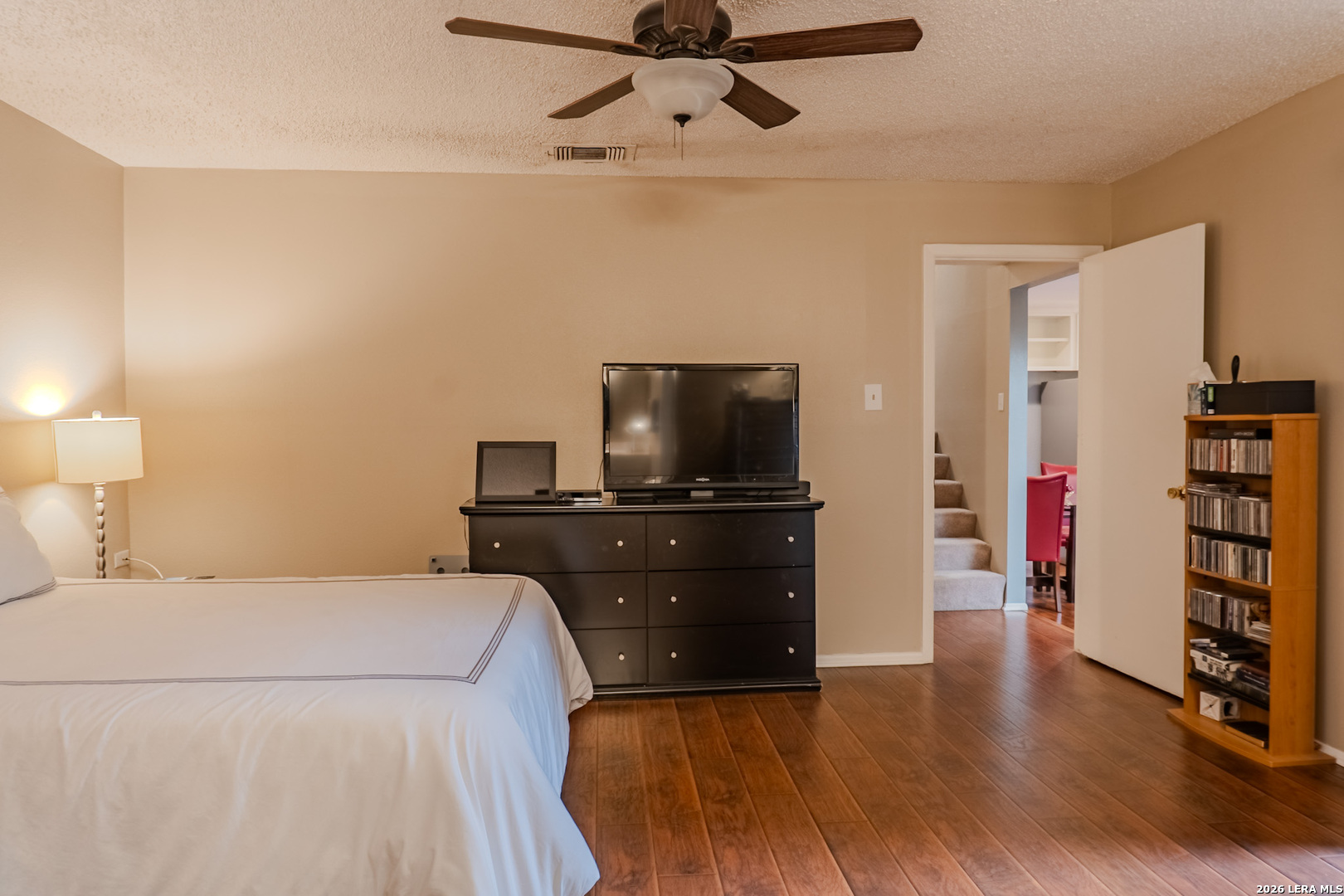 8942 Willmon Way Windcrest, TX 78239 - Photo 33 of 44 a bedroom with a bed and a television