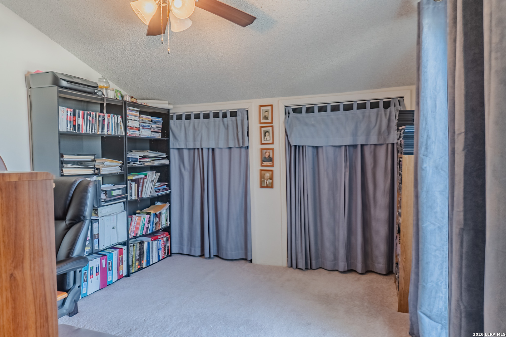 8942 Willmon Way Windcrest, TX 78239 - Photo 34 of 44 a view of a livingroom with furniture and a book shelf