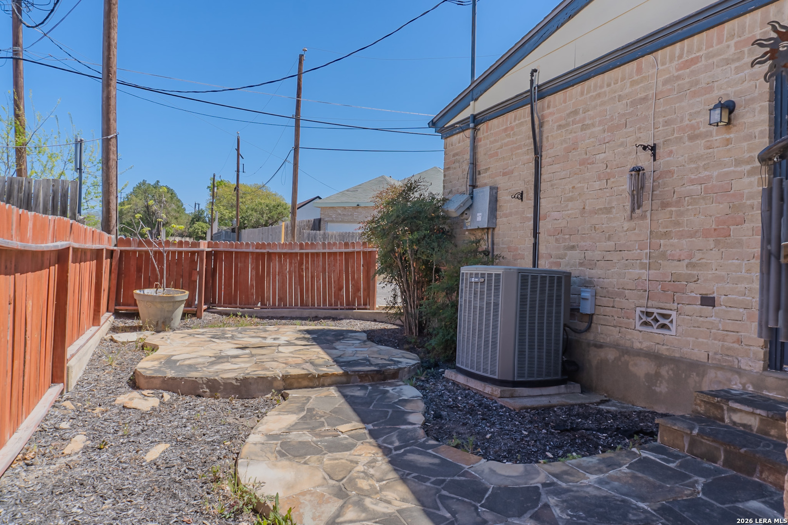 8942 Willmon Way Windcrest, TX 78239 - Photo 42 of 44 a view of a backyard with a small cabin and wooden fence