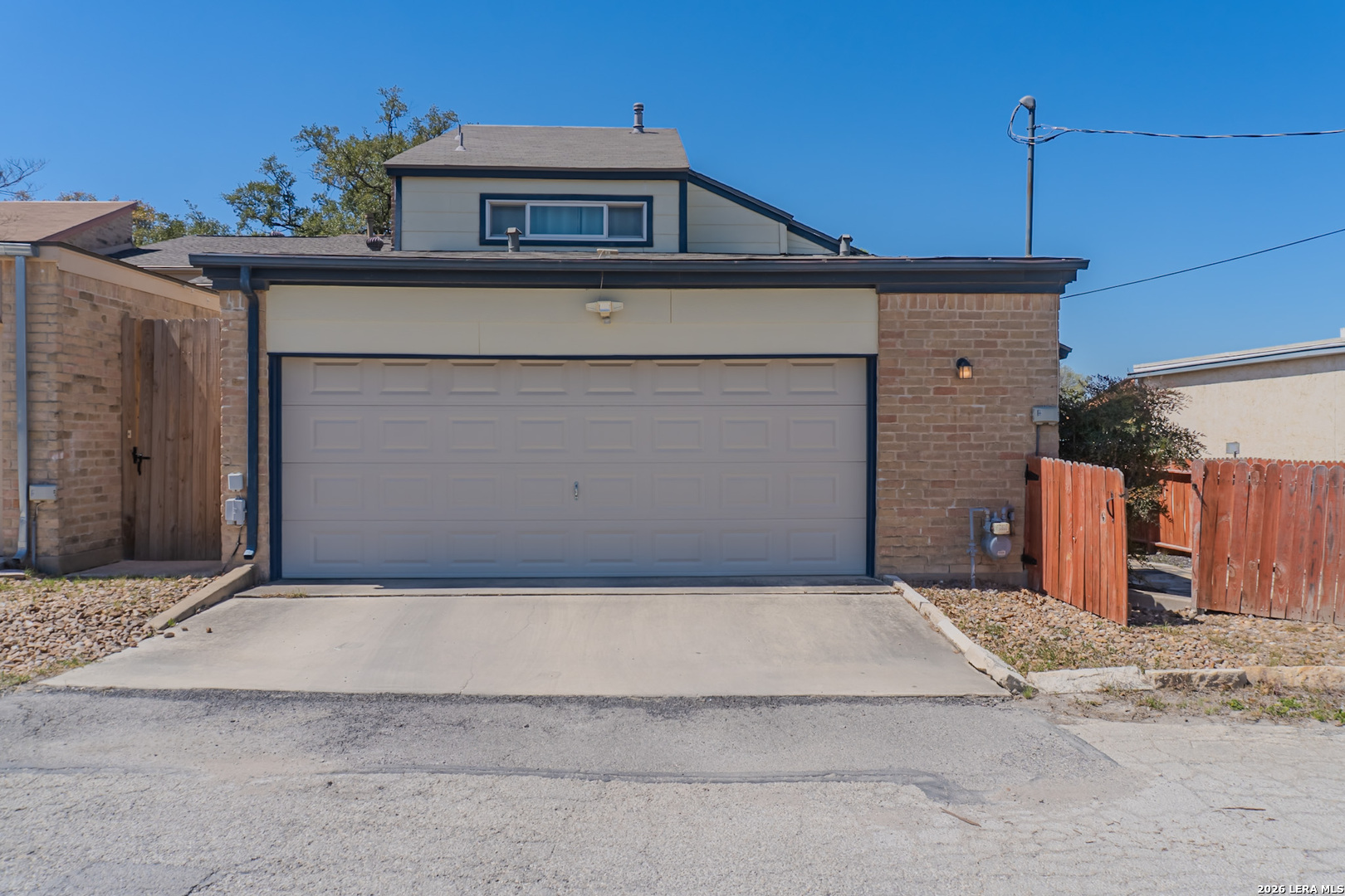 8942 Willmon Way Windcrest, TX 78239 - Photo 43 of 44 a front view of a house with a garage
