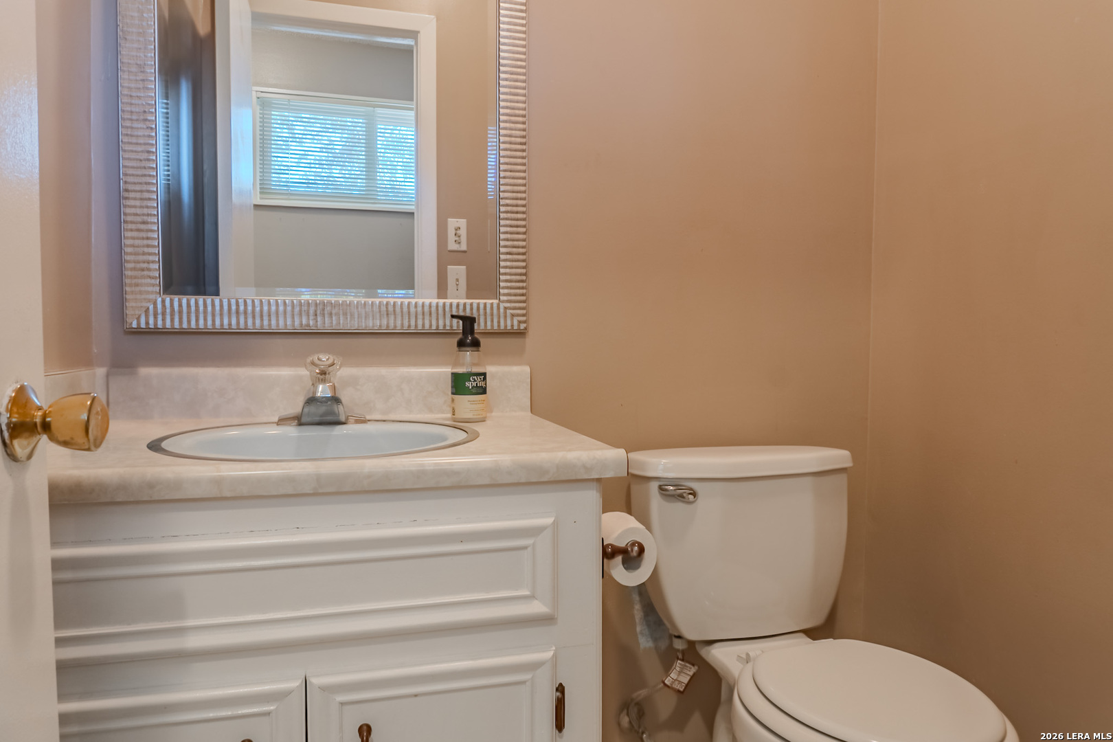8942 Willmon Way Windcrest, TX 78239 - Photo 6 of 44 a bathroom with a sink and a toilet
