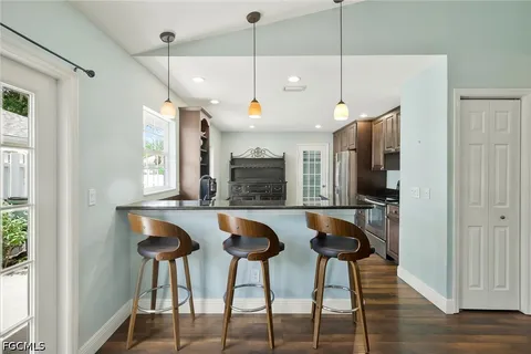 a kitchen with stainless steel appliances granite countertop a stove a sink and a refrigerator