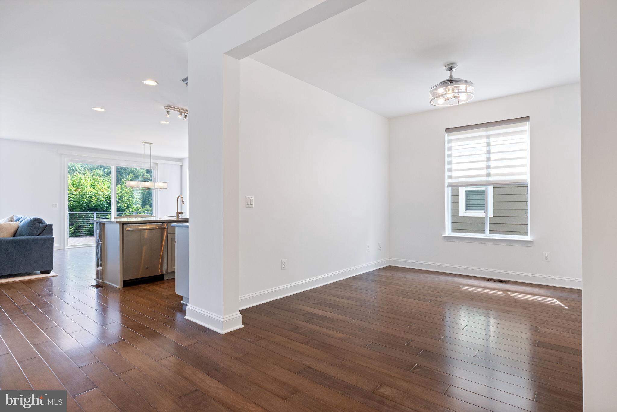 112 Flycatcher Way White Post, VA 22663 - Photo 11 of 59 a view of an empty room with wooden floor and a window
