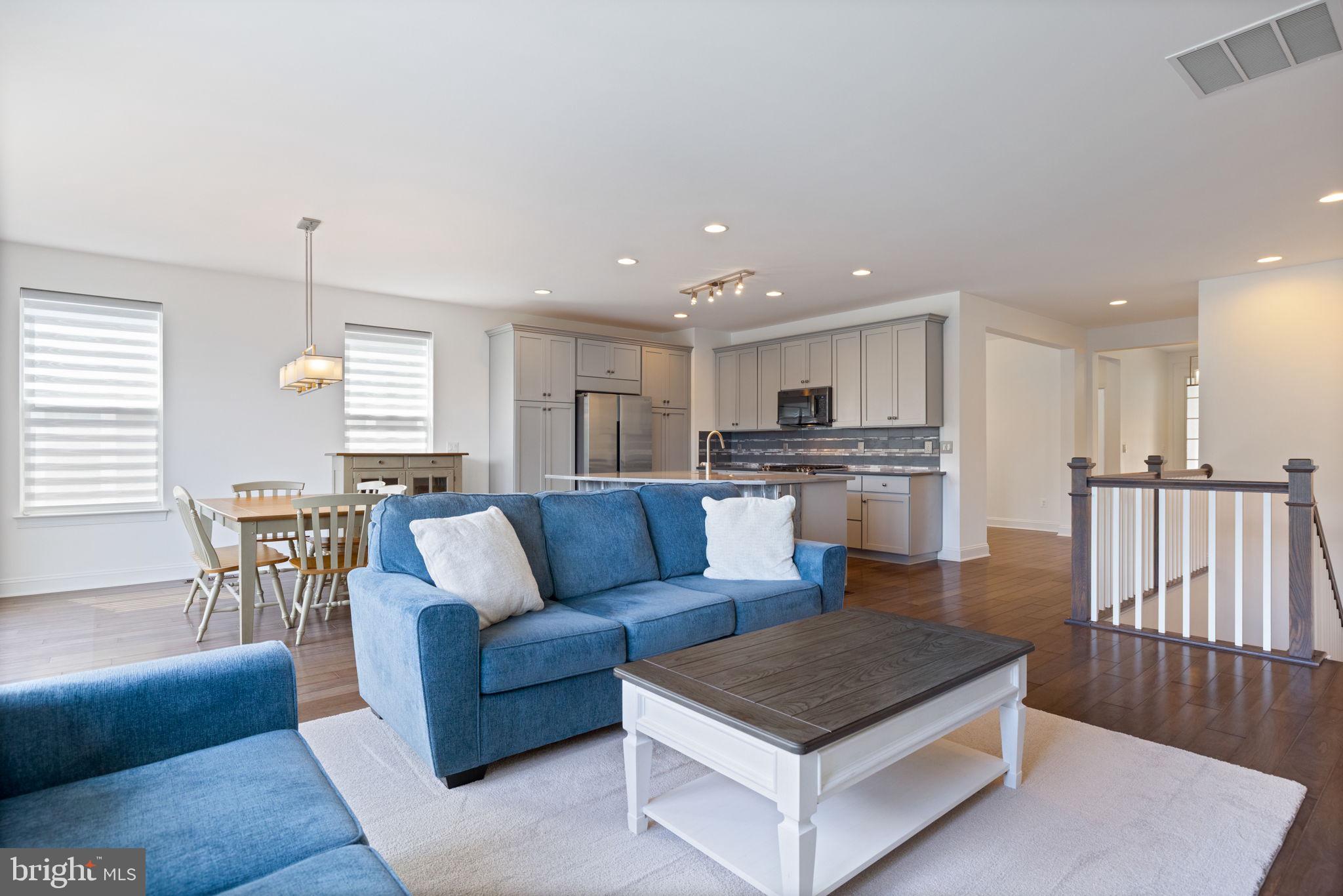 112 Flycatcher Way White Post, VA 22663 - Photo 15 of 59 a living room with furniture wooden floor and a kitchen view