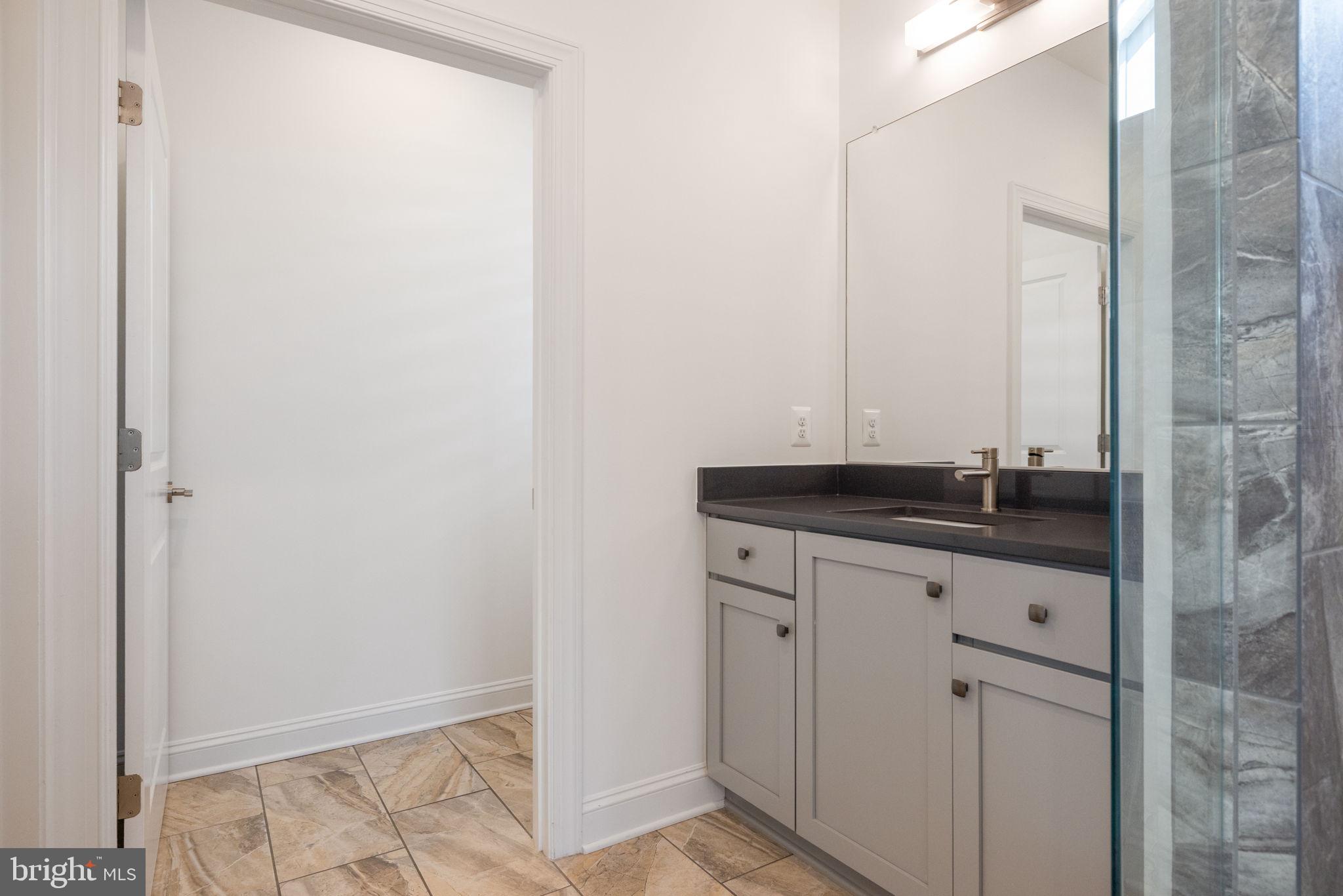 112 Flycatcher Way White Post, VA 22663 - Photo 29 of 59 a bathroom with a sink and a mirror