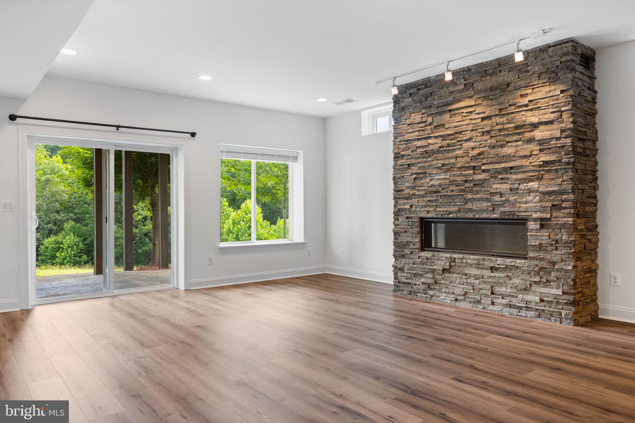 112 Flycatcher Way White Post, VA 22663 - Photo 33 of 59 a view of an empty room with a window and wooden floor