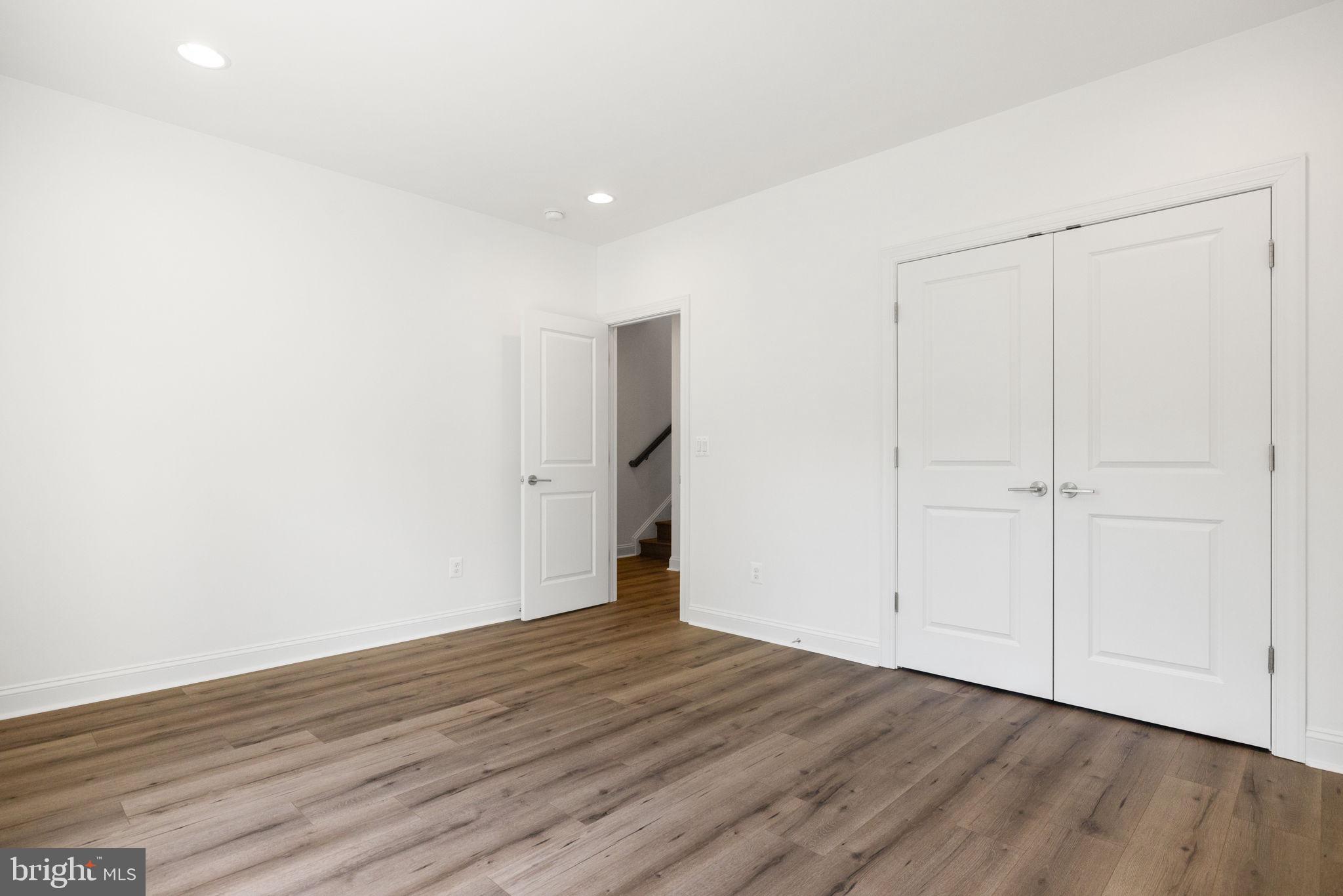 112 Flycatcher Way White Post, VA 22663 - Photo 39 of 59 a view of an empty room with wooden floor