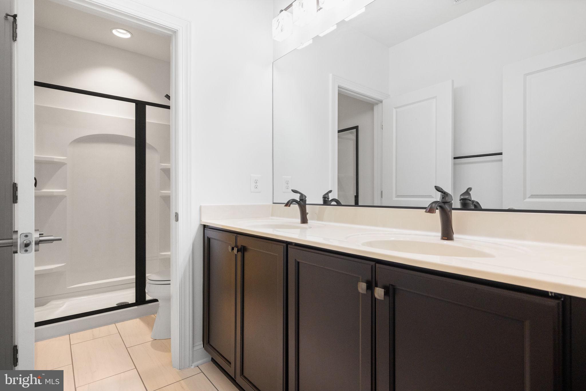 112 Flycatcher Way White Post, VA 22663 - Photo 40 of 59 a bathroom with a double vanity sink a and mirror