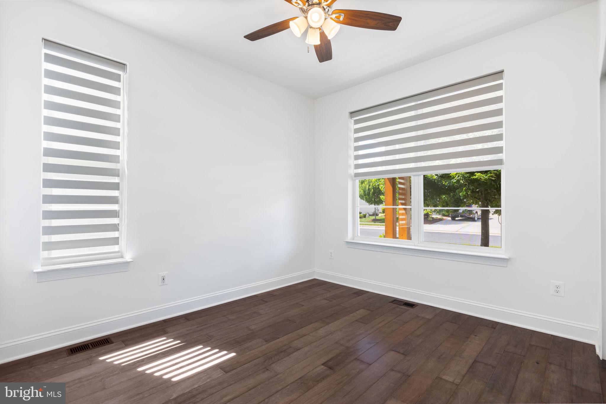 112 Flycatcher Way White Post, VA 22663 - Photo 6 of 59 a view of an empty room with wooden floor and a window
