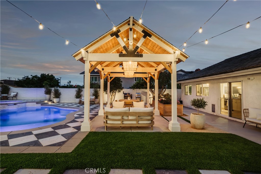 13822 Henstridge Circle Tustin, CA 92780 - Photo 15 of 61 a view of a house with swimming pool and furniture