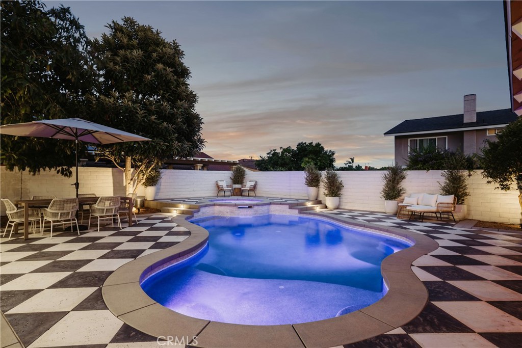 13822 Henstridge Circle Tustin, CA 92780 - Photo 16 of 61 a swimming pool with outdoor seating yard