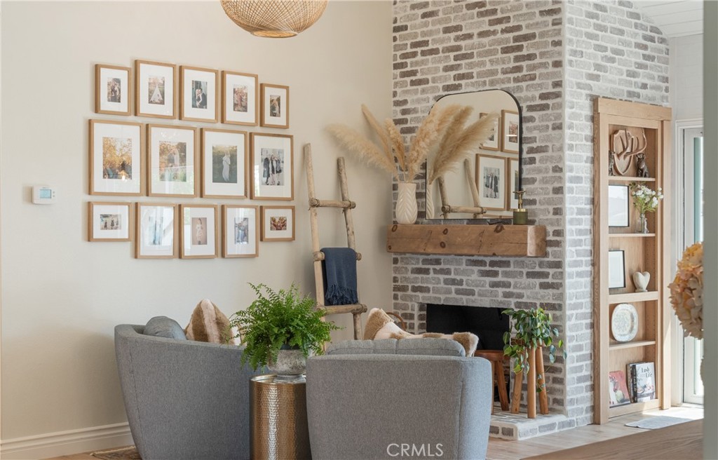 13822 Henstridge Circle Tustin, CA 92780 - Photo 28 of 61 a living room with furniture a fireplace and a table