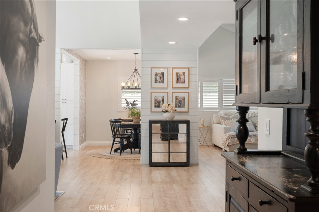 13822 Henstridge Circle Tustin, CA 92780 - Photo 36 of 61 a living room with furniture a desk and kitchen view