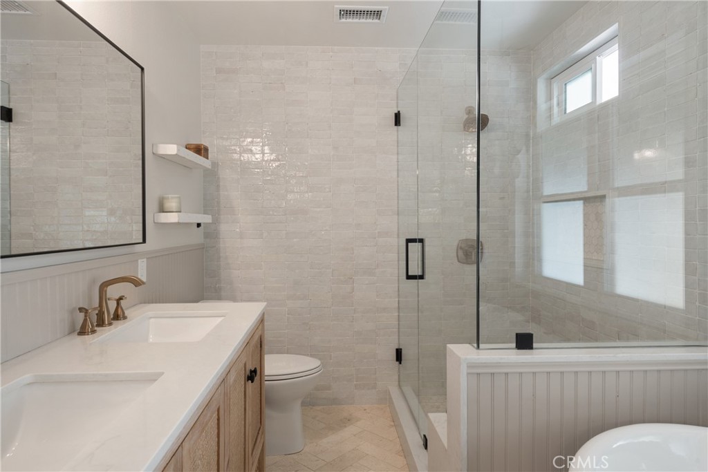 13822 Henstridge Circle Tustin, CA 92780 - Photo 41 of 61 a bathroom with a sink toilet and shower