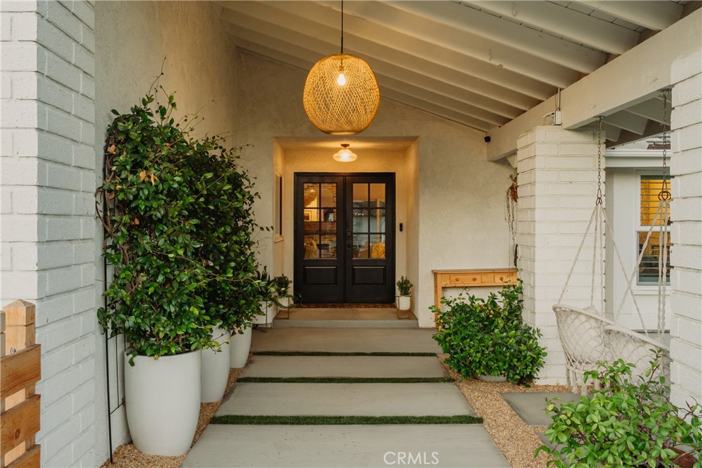 13822 Henstridge Circle Tustin, CA 92780 - Photo 5 of 61 a front view of a house with a garden