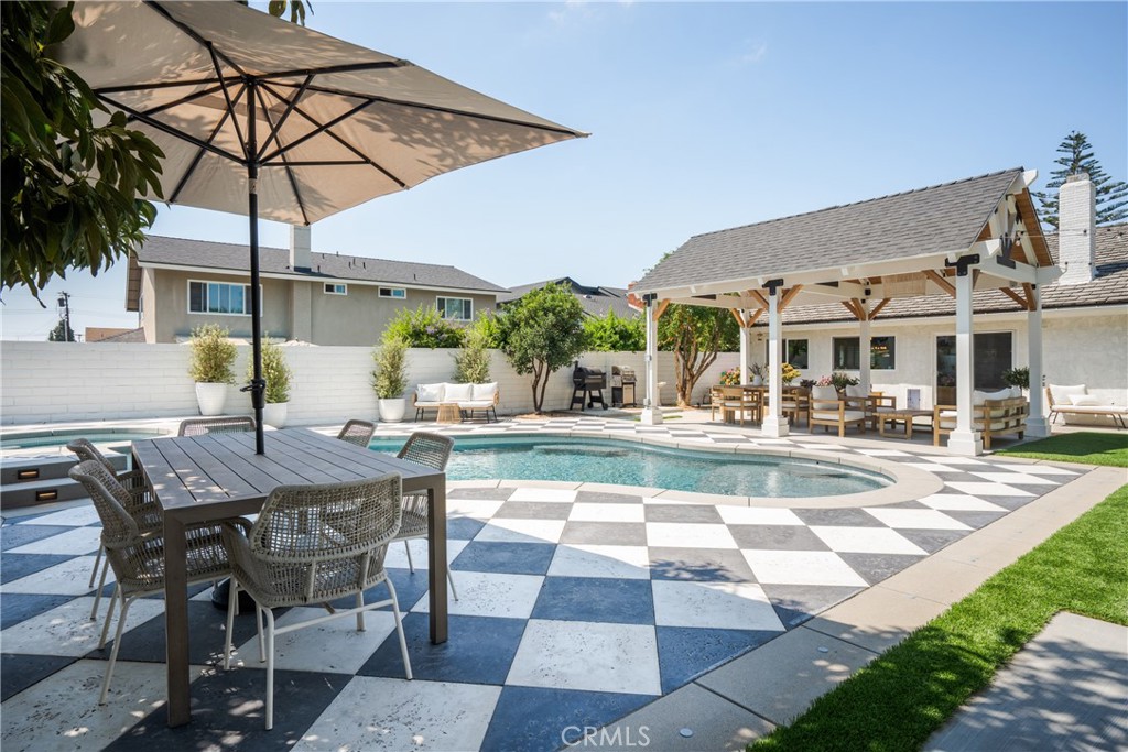 13822 Henstridge Circle Tustin, CA 92780 - Photo 58 of 61 a view of a patio with a table and chairs