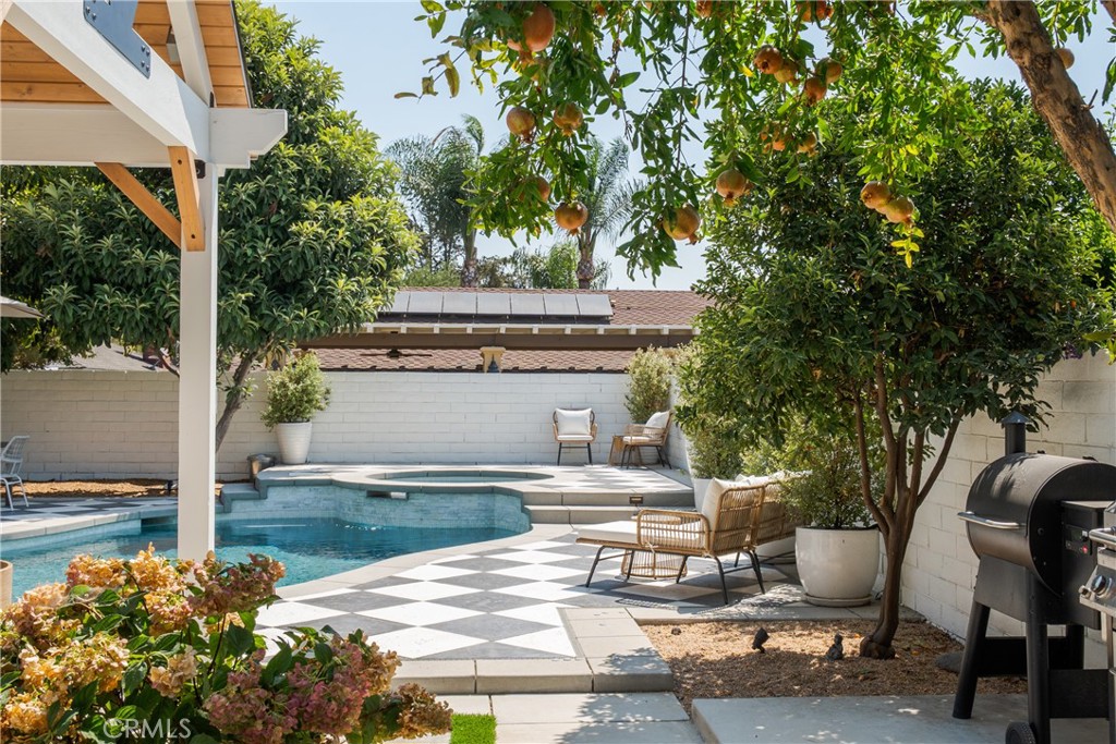 13822 Henstridge Circle Tustin, CA 92780 - Photo 59 of 61 a view of a patio with table and chairs and potted plants