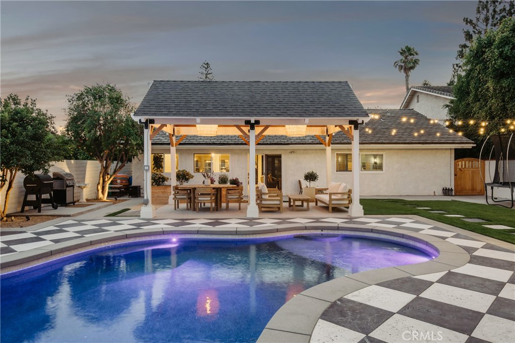 13822 Henstridge Circle Tustin, CA 92780 - Photo 7 of 61 a view of a swimming pool with a patio