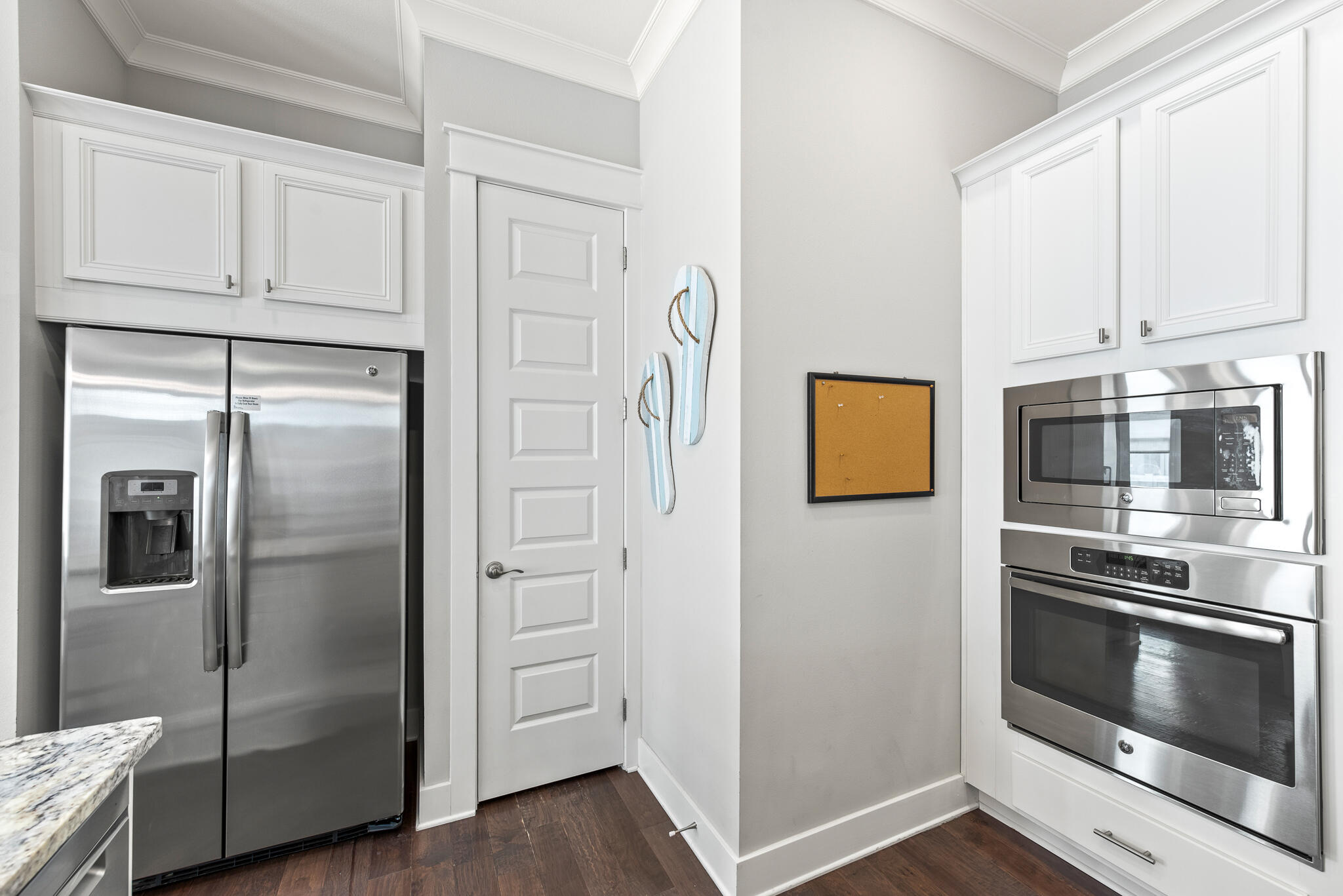 26 Milestone Dr Inlet Beach, Unit C Inlet Beach, FL 32461 - Photo 20 of 36 a kitchen with stainless steel appliances granite countertop a refrigerator and a stove top oven