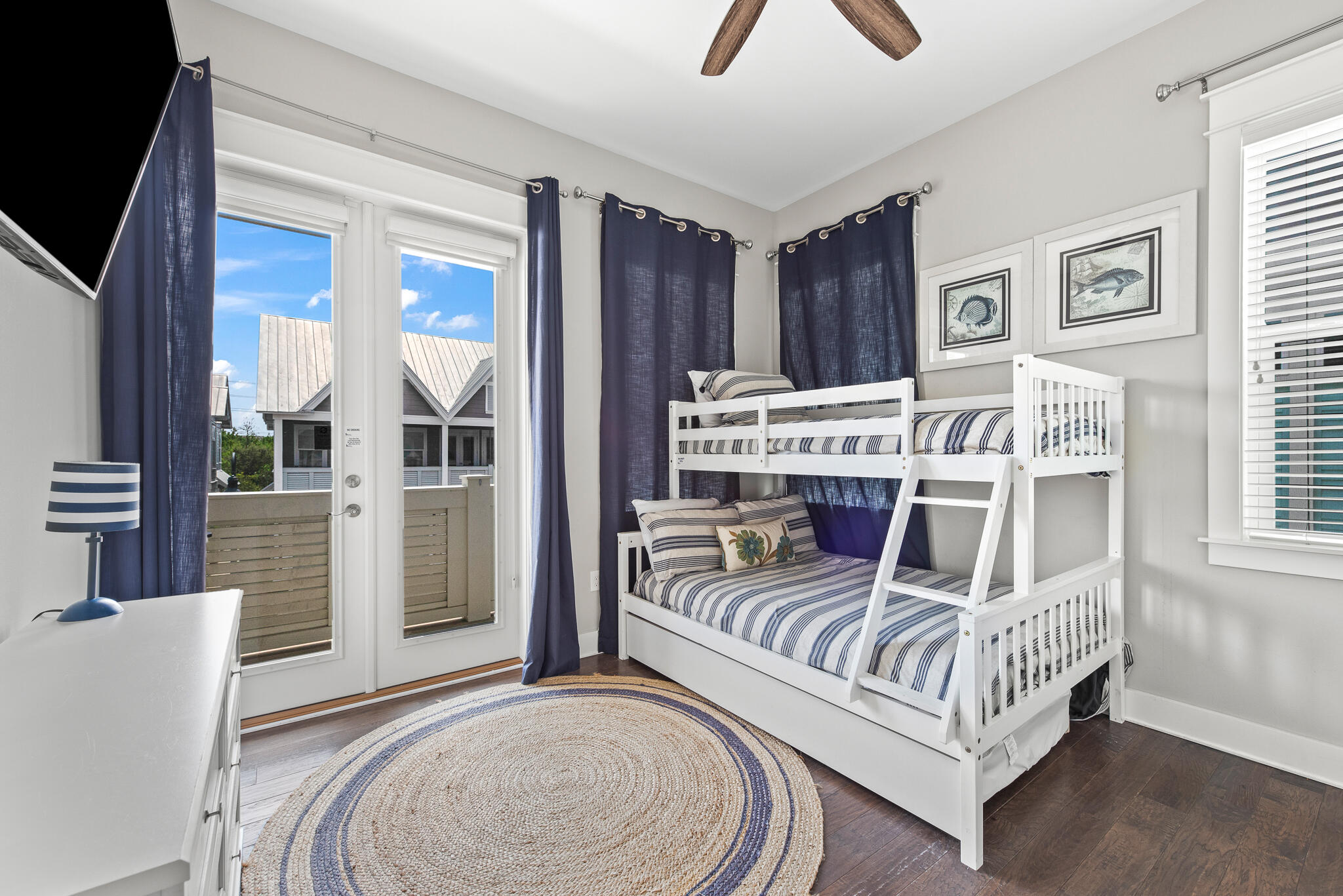 26 Milestone Dr Inlet Beach, Unit C Inlet Beach, FL 32461 - Photo 24 of 36 a bedroom with a bed and a view of kitchen