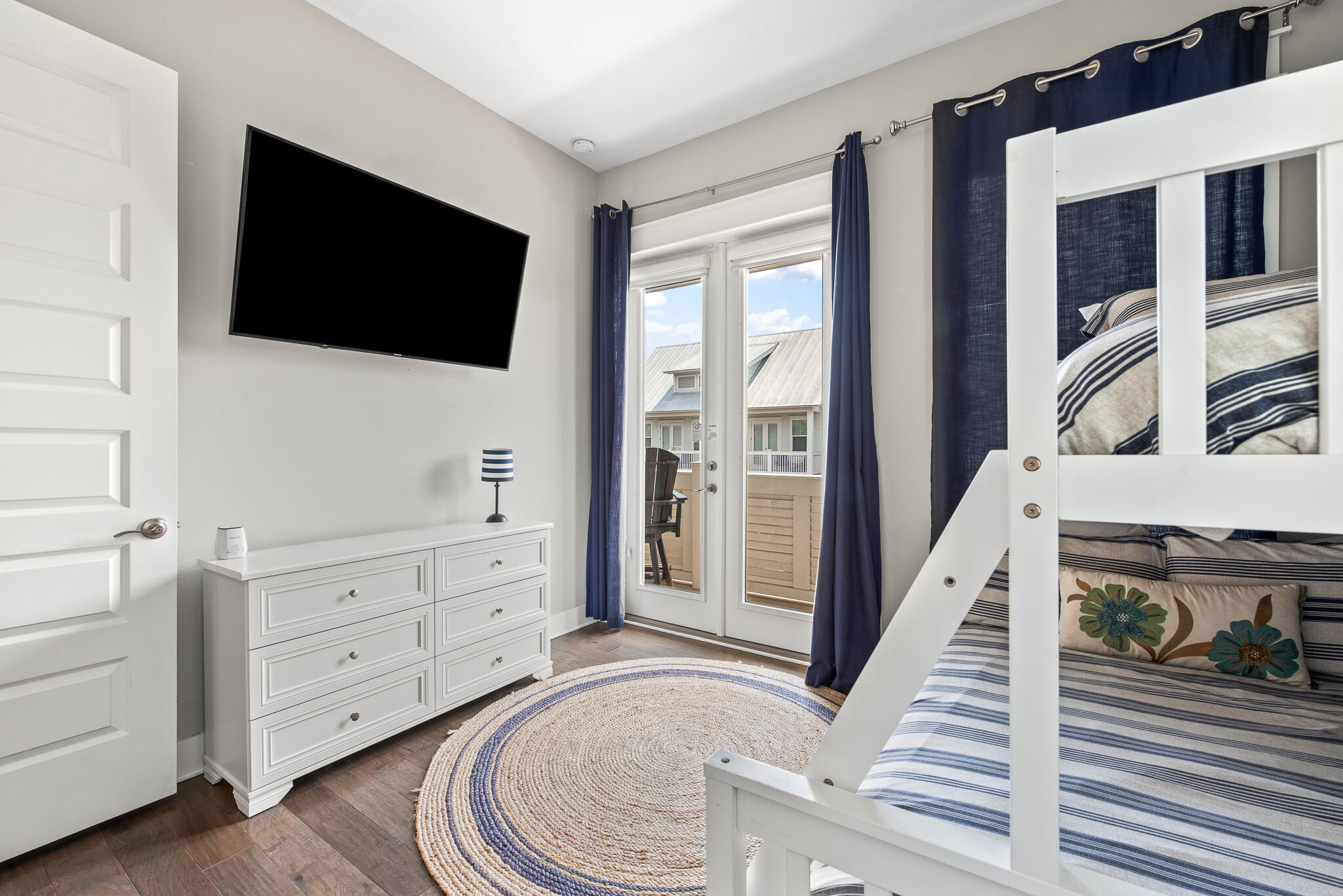 26 Milestone Dr Inlet Beach, Unit C Inlet Beach, FL 32461 - Photo 25 of 36 a living room with furniture and a flat screen tv