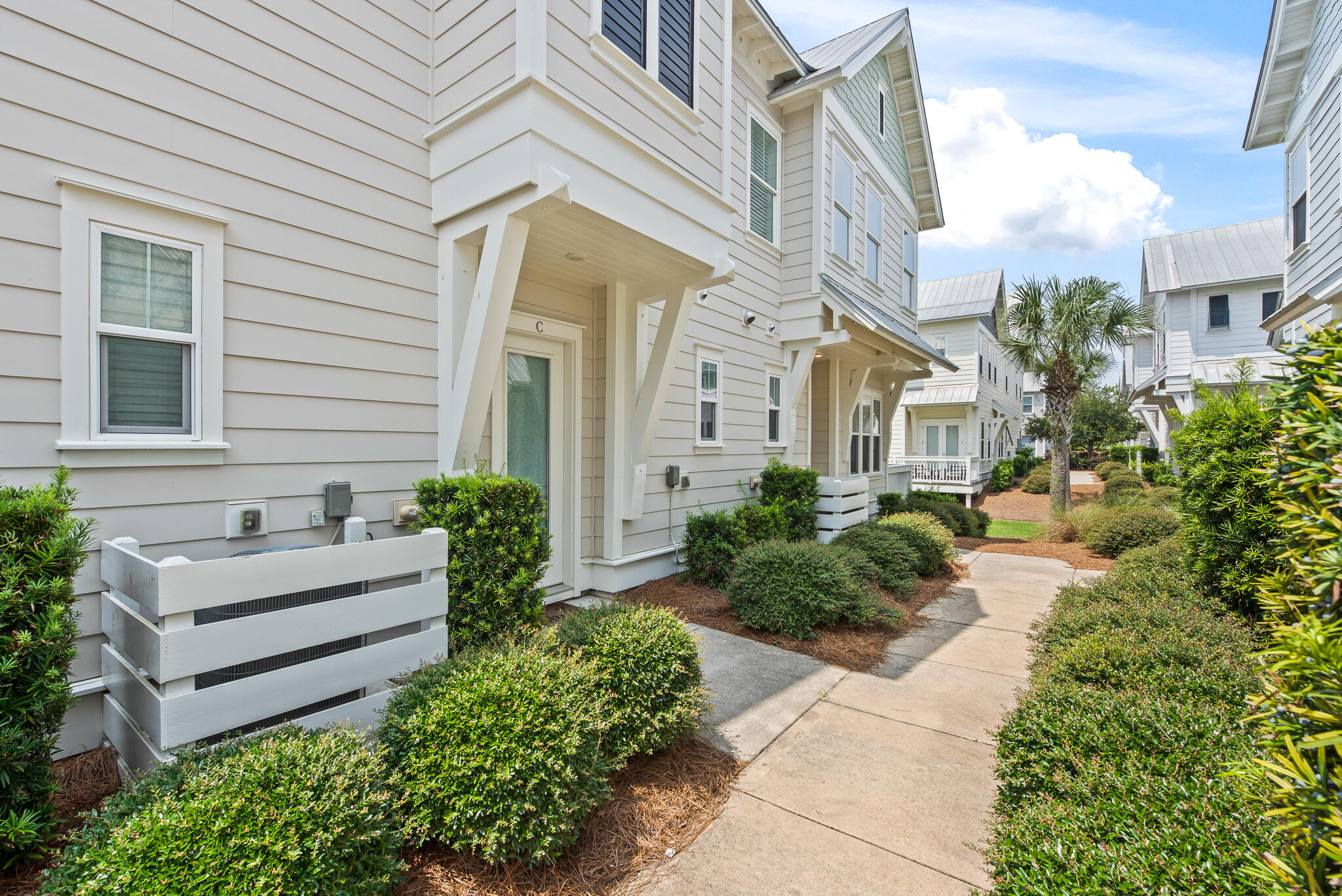 26 Milestone Dr Inlet Beach, Unit C Inlet Beach, FL 32461 - Photo 33 of 36 a view of a house with potted plants