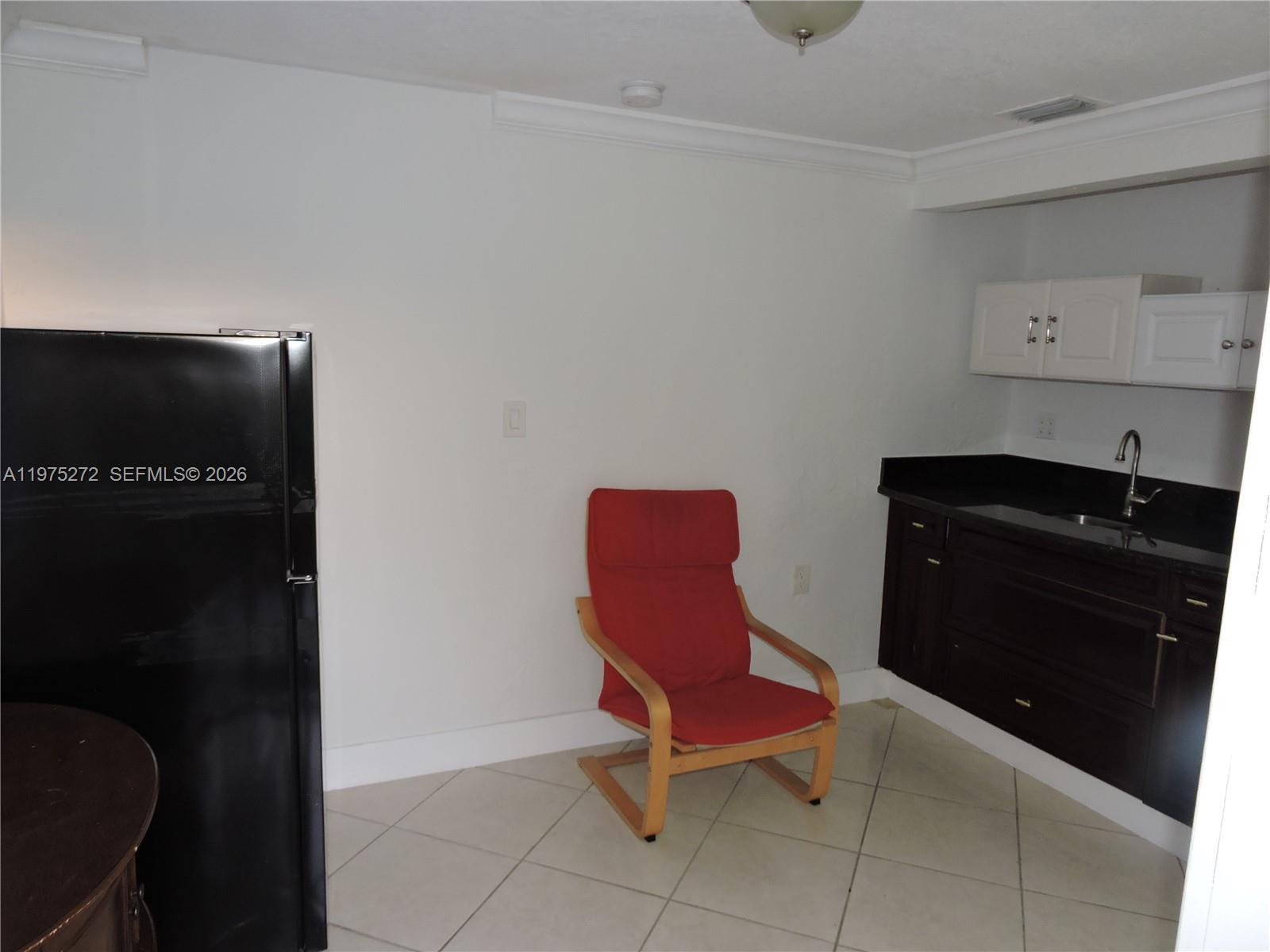 551 East 39th Street Hialeah, FL 33013 - Photo 12 of 14 a living room with furniture