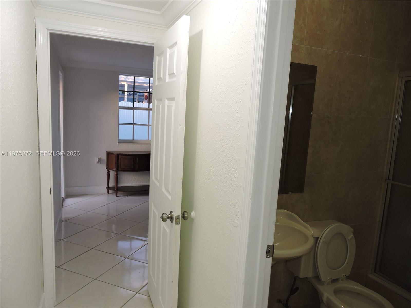 551 East 39th Street Hialeah, FL 33013 - Photo 9 of 14 a bathroom with a sink and a toilet