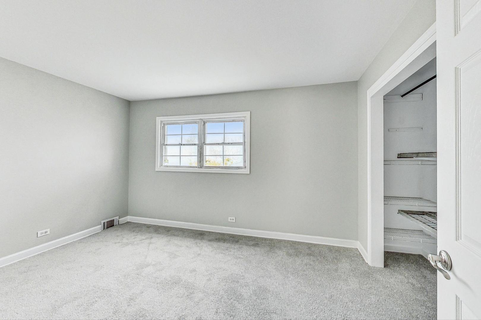 2212-2214 Oakton Street Park Ridge, IL 60068 - Photo 15 of 43 a view of an empty room with a window