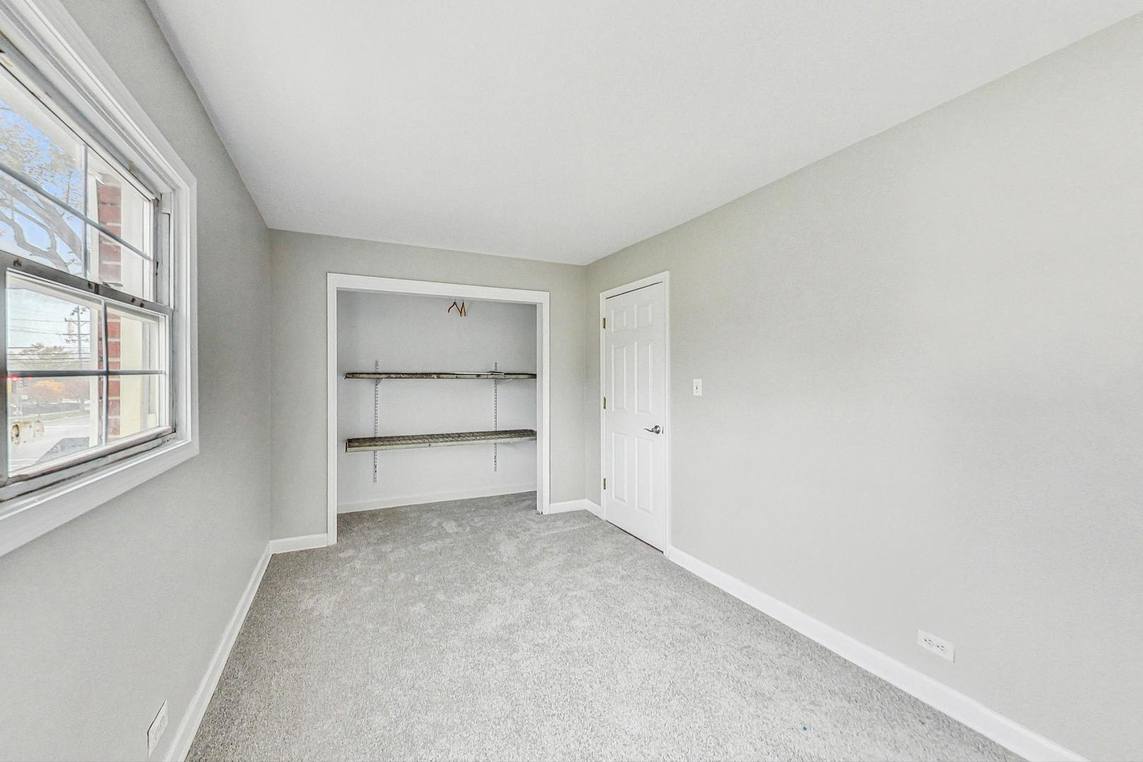 2212-2214 Oakton Street Park Ridge, IL 60068 - Photo 17 of 43 a view of an empty room with a window