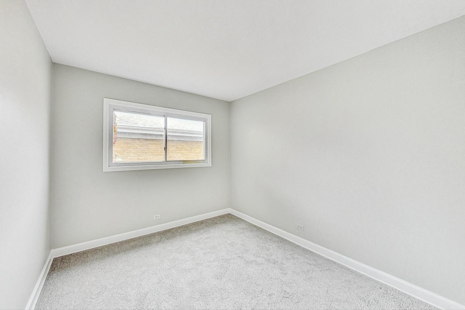 2212-2214 Oakton Street Park Ridge, IL 60068 - Photo 19 of 43 an empty room with a window