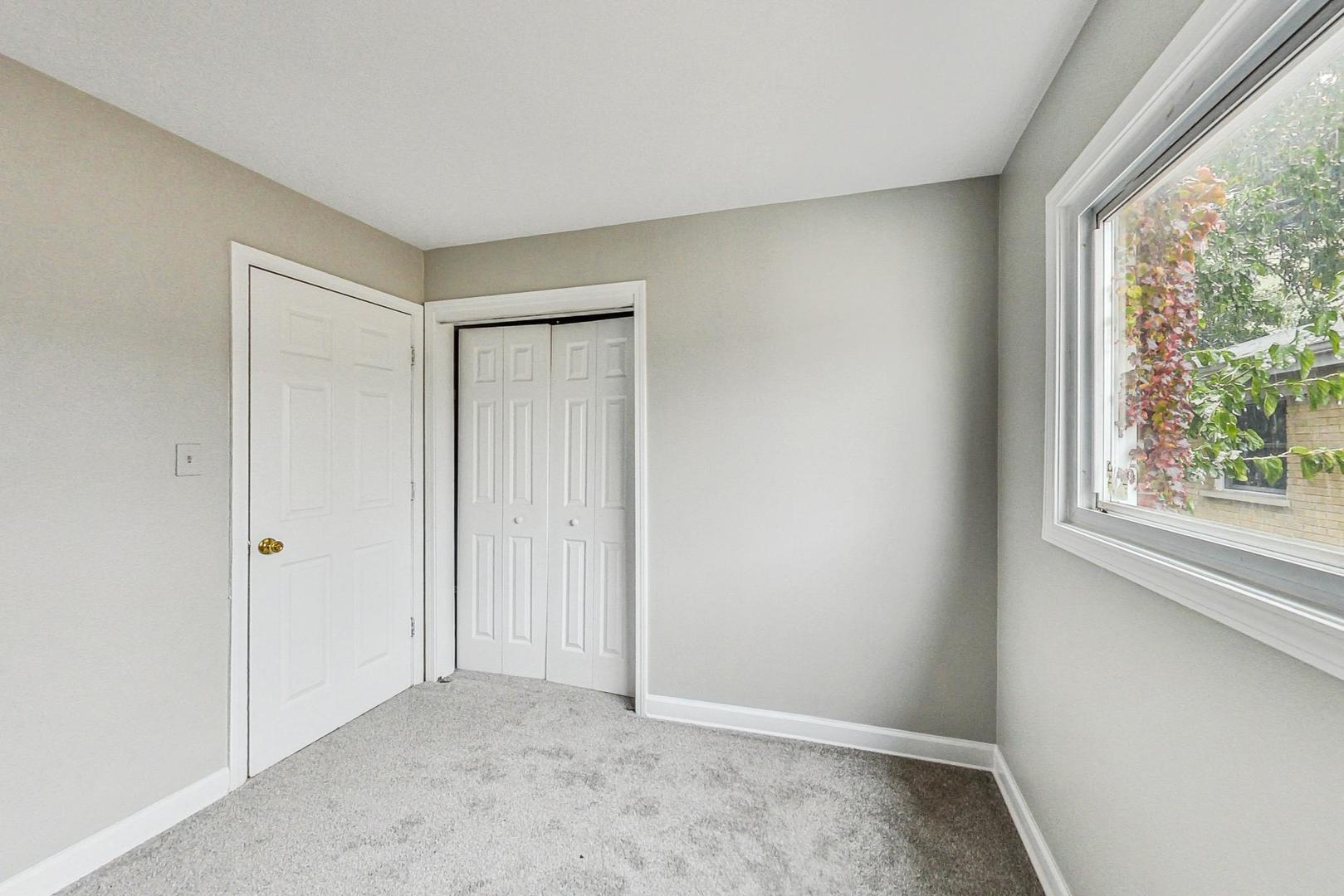 2212-2214 Oakton Street Park Ridge, IL 60068 - Photo 21 of 43 a view of an empty room with a window