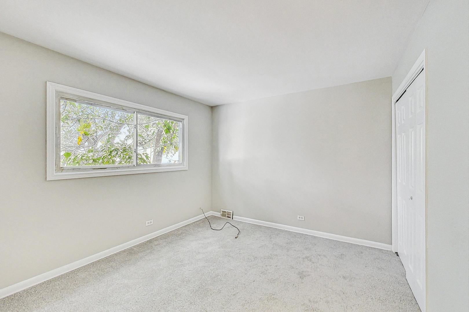 2212-2214 Oakton Street Park Ridge, IL 60068 - Photo 22 of 43 an empty room with windows