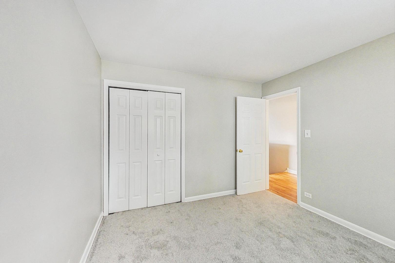2212-2214 Oakton Street Park Ridge, IL 60068 - Photo 23 of 43 a view of an empty room and chandelier fan
