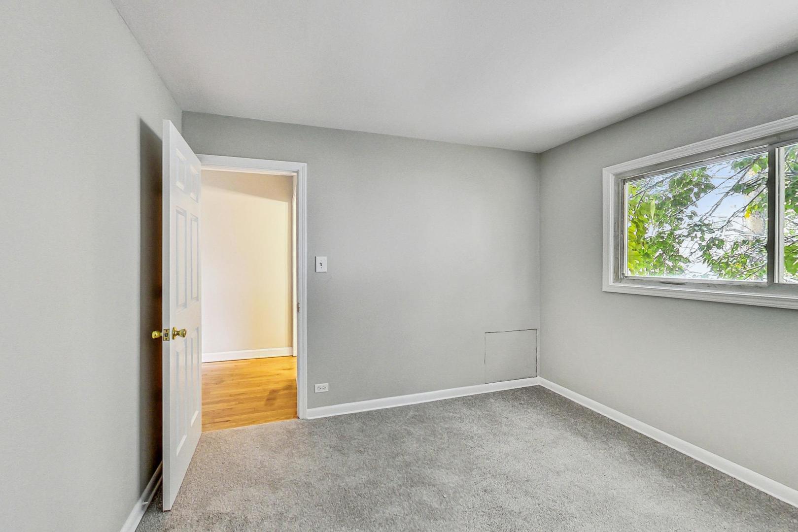 2212-2214 Oakton Street Park Ridge, IL 60068 - Photo 24 of 43 an empty room with a window