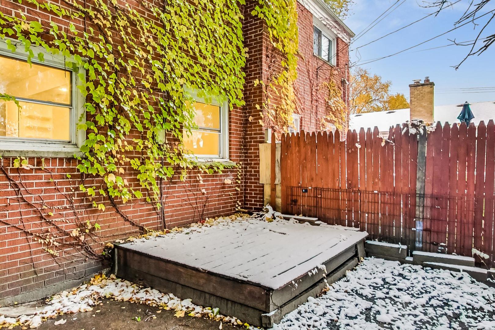 2212-2214 Oakton Street Park Ridge, IL 60068 - Photo 30 of 43 a view of a patio with a table and chairs