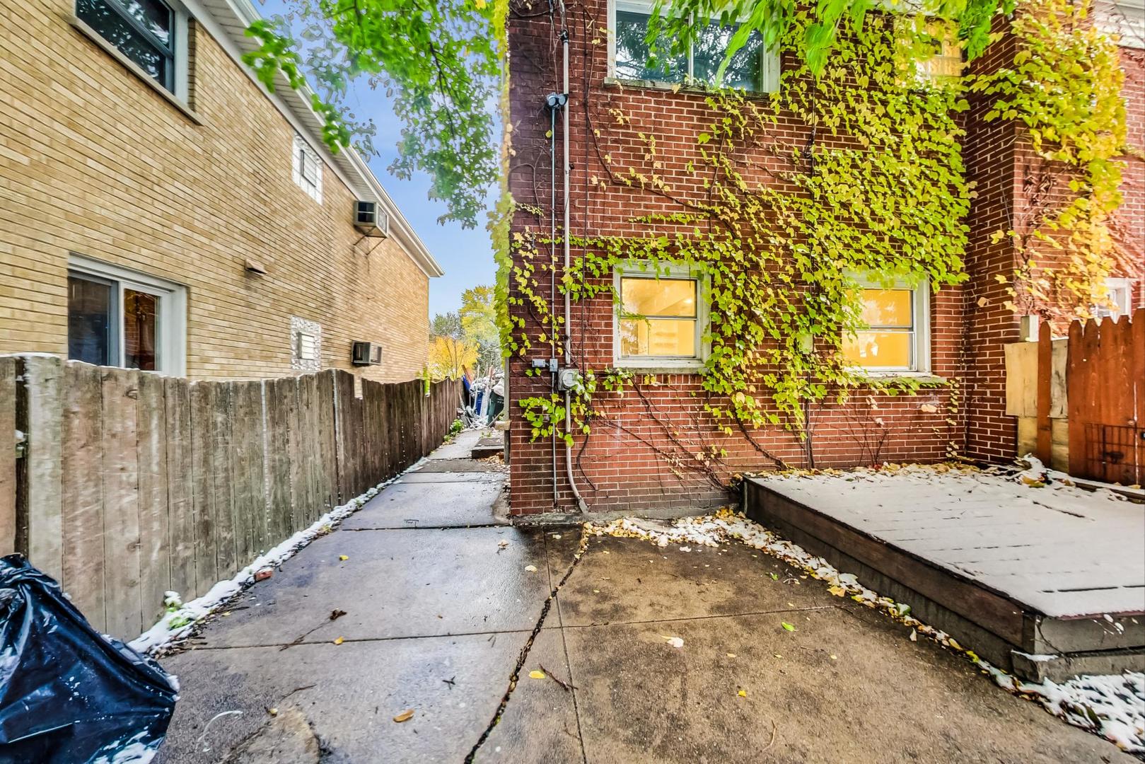 2212-2214 Oakton Street Park Ridge, IL 60068 - Photo 33 of 43 a view of a patio with wooden fence
