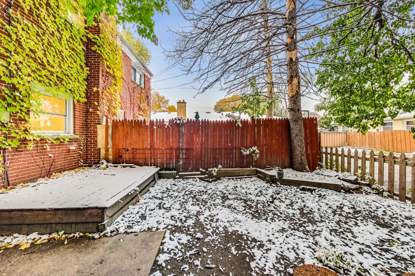 2212-2214 Oakton Street Park Ridge, IL 60068 - Photo 36 of 43 a backyard of a house with a tree