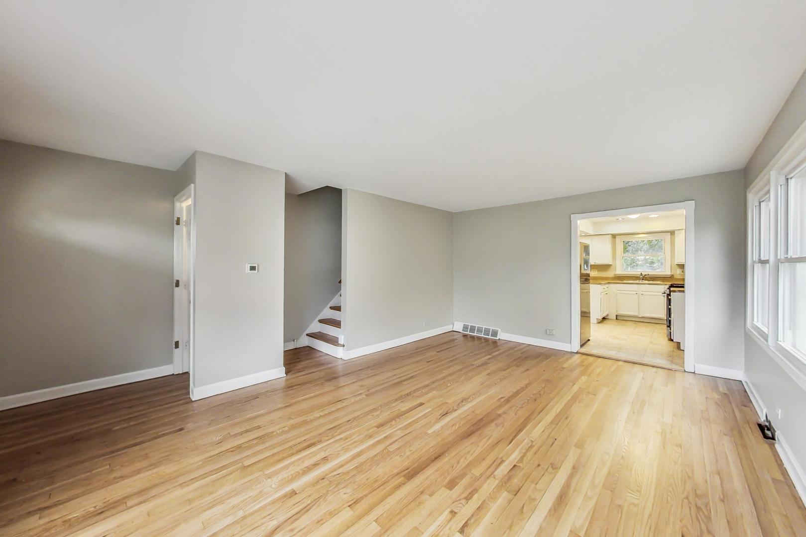 2212-2214 Oakton Street Park Ridge, IL 60068 - Photo 6 of 43 a view of empty room with wooden floor and fan