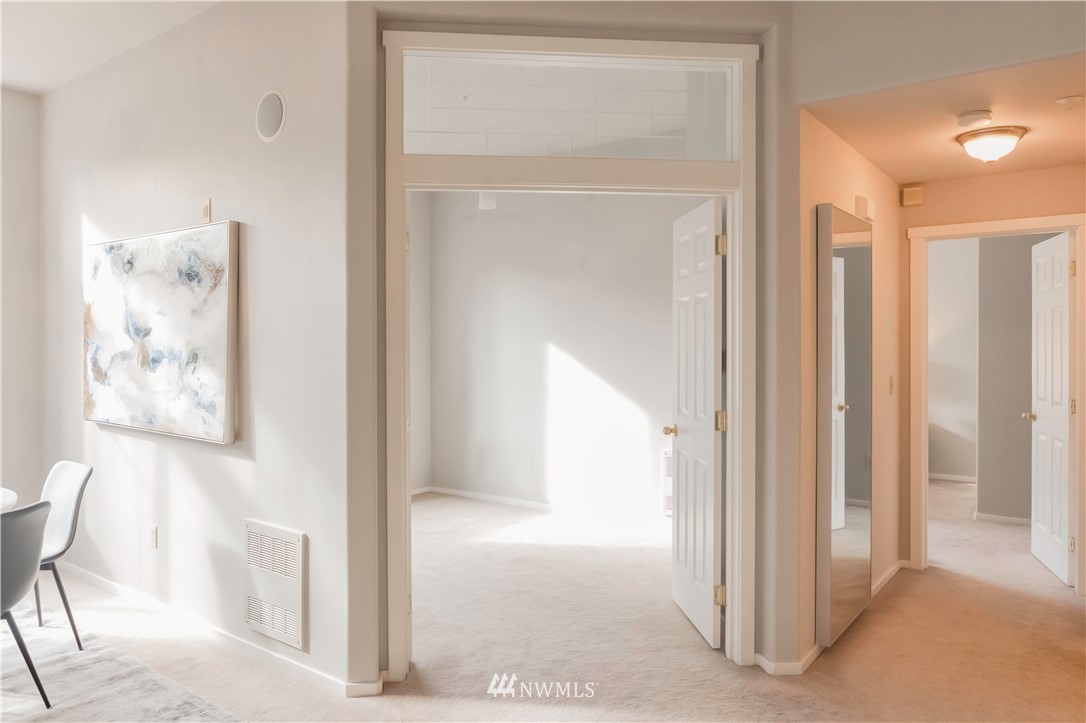 4319 Northeast 5th Court, Unit 102 Renton, WA 98059 - Photo 17 of 32 a view of a hallway with interior of the house
