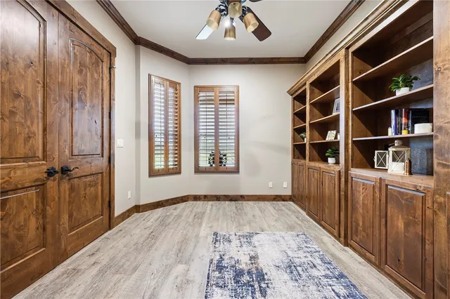 a kitchen with a dining table chairs stainless steel appliances and cabinets