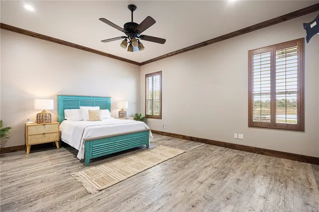 a room with a bed and a chandelier