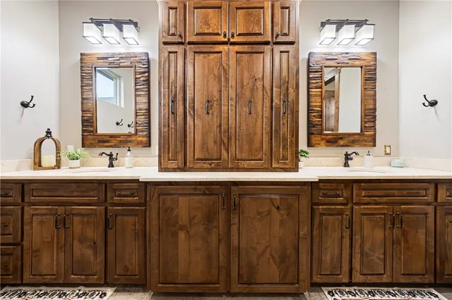 a bathroom with a double vanity sink and mirror