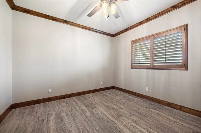 a kitchen with wooden cabinets and a stove top oven
