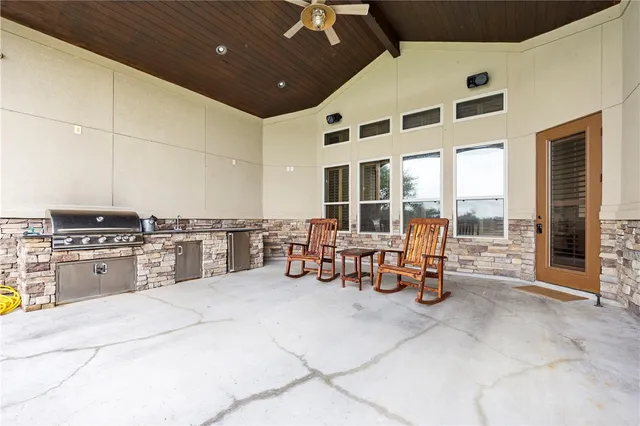 a view of a lake with houses in the back