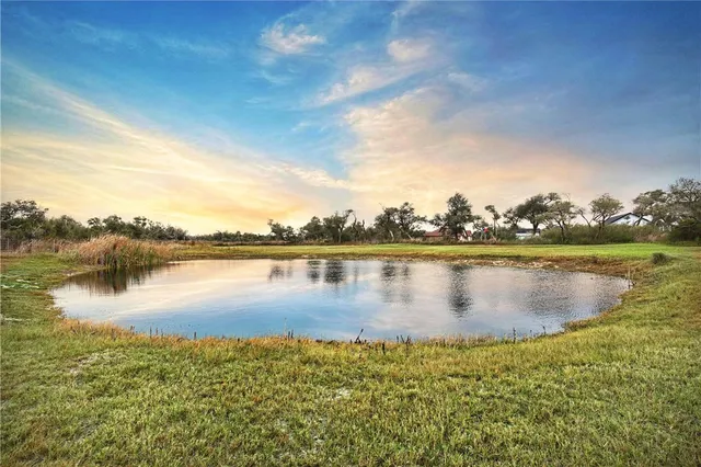 a view of a lake with a city