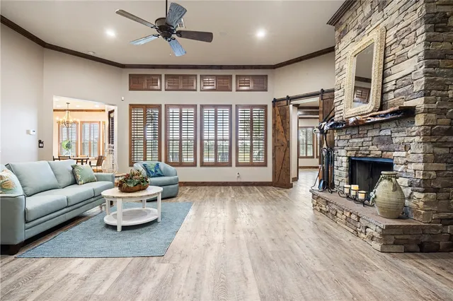 a living room with furniture fireplace and flat screen tv