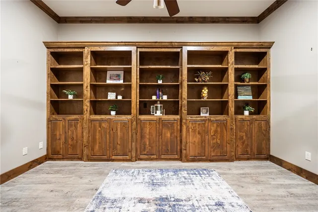 wooden floor in a room next to a window