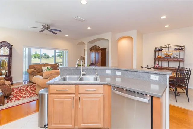 a bathroom with a granite countertop sink a large mirror and a shower